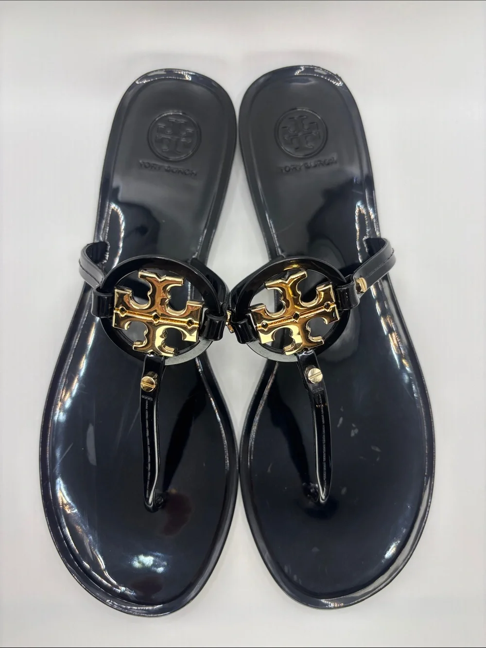 Tory Burch Black Jelly Thong Sandals with Gold Logo Medallions
